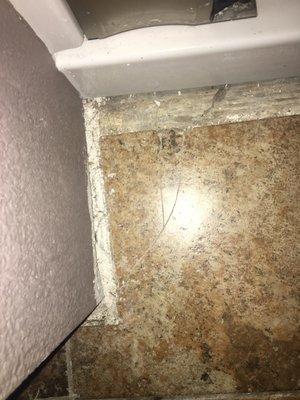 My master bathroom tile was BRAND NEW the crew cracked it near faulty shower installation .