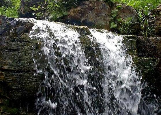 Land for sale has beautiful Waterfall on it in Cherokee Village, Arkansas from Homestead Crossing