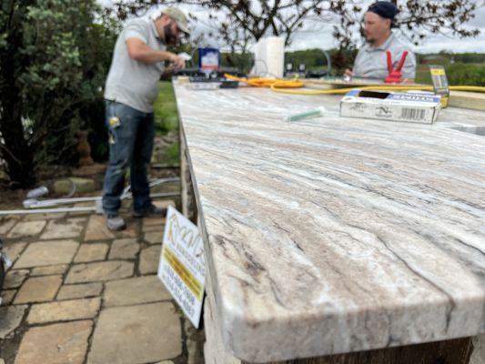 Kml Remodeling installing a gorgeous ,custom leather granite stone bar top!