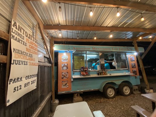 Taco stand with picnic tables