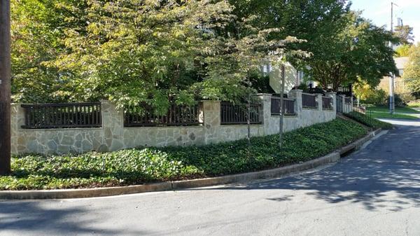 Design and build  a 100 feet retaining wall with columns and proper footings to last for many years to come...