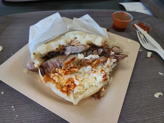 There signature item is Arepa's (sandwiches made with cornmeal flatbread and filled with meat or beans).  This is the pork version.