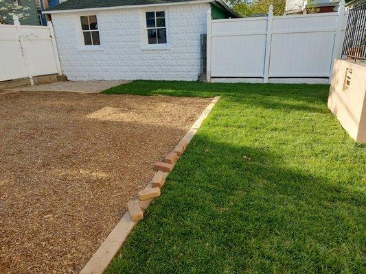 Finished lawn and play area for kids.