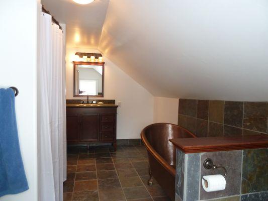 Ready for a luxurious bath in this remodeled room in the eaves?