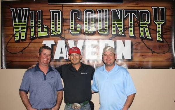 Chet Pulsipher and Mr. Adams with Cesar de la Cruz at Wild Country Tavern