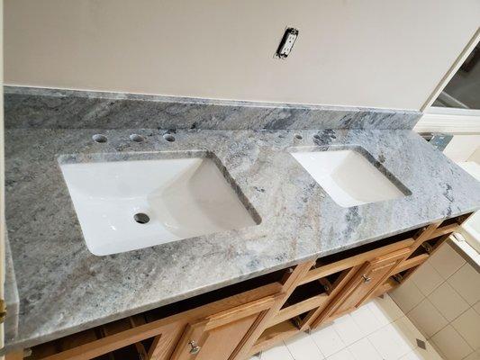 this double sink vanity  is fantasy river  marble counter top this beautiful color  is amazing