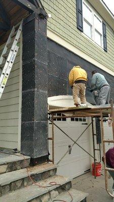 Installing the final presidure  waterproof paper and wire mesh to start laying stone