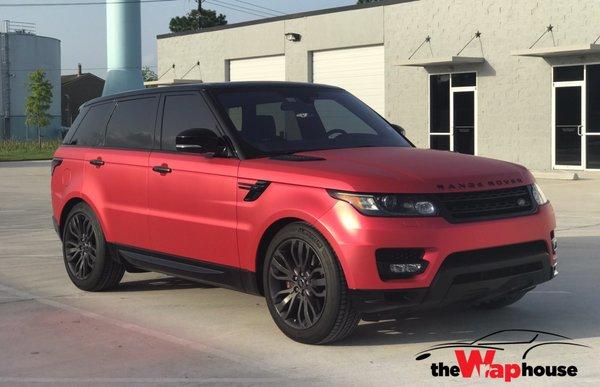 Satin red Range Rover.