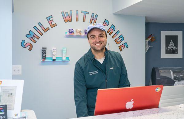 Tyler, co-owner of Big Gay Smiles greets our patients at the front desk!