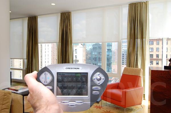 Electric shades operate by Crestron panel