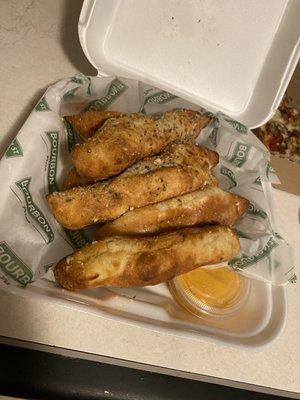 Famous bread sticks with cheese sauce.