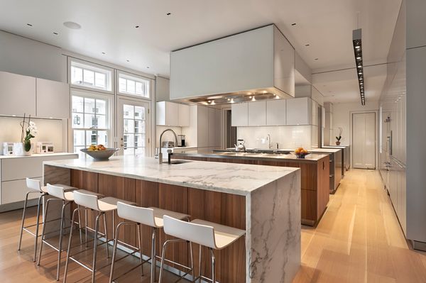 Custom kitchen with waterfall marble counters in Riverside, CT by Davenport Contracting Inc.