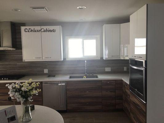 Modern kitchen done by Deluxe Cabinets.