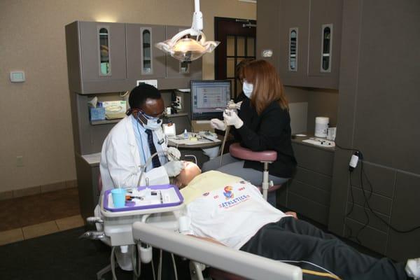 Dr. Omido working on a patient