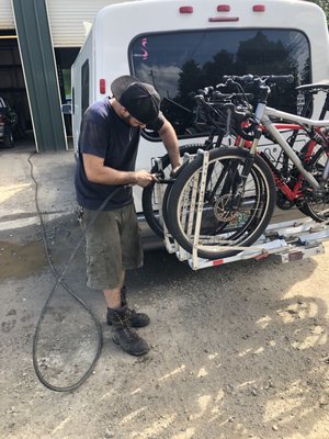 Swann Tire helping us get our lock off our bikes because we lost the key. Super friendly and awesome service. Thanks Swann!!