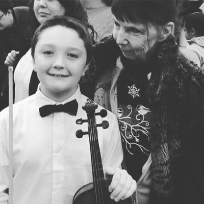 Lance and (Grandma) and his violin at the Strings Concert at Valley View Middle School