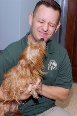 Dr. Wilkerson getting a puppy kiss