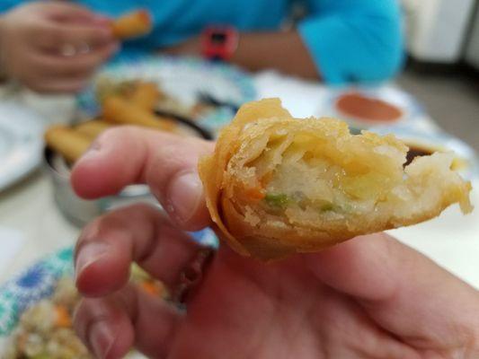 Inside egg roll- veggie bits and noodles