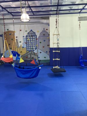 rock wall and swings