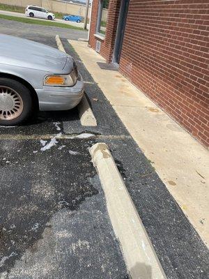 Slobs dumped soapy dirty water from mopping tossed out managers door onto sidewalk and blacktop every day