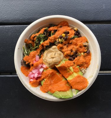 Southwest Bowl! Br. rice, greens, black bean + corn salad, broccoli, pickled onions, cashew queso, avocado, roasted red pepper dressing v/GF