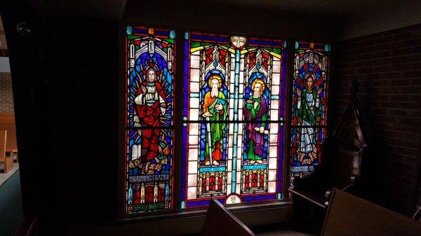 Stained glass from our founding mission parishes