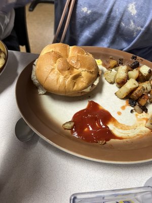 Breakfast sandwich, eggs, and hashbrowns