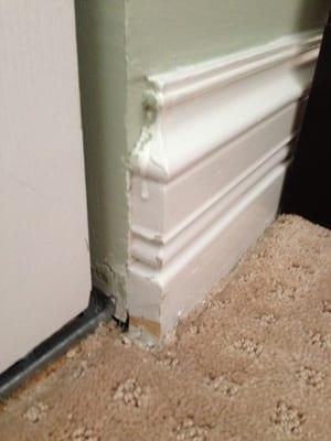 Drippy paint. Old paint still showing.  Wall paint on trim. Trim not painted near the ground.