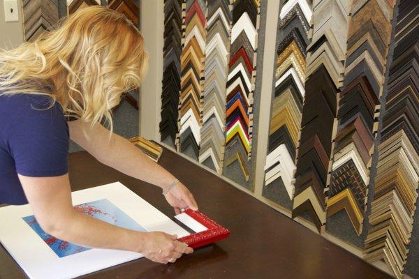 Owner and framing designer, Allison Nichols, creating in the new design room.