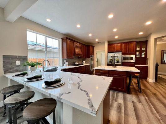 Quartz countertops with a huge island makes for great gatherings.