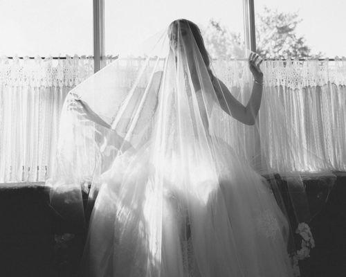 Artistic bridal portraits with long veil