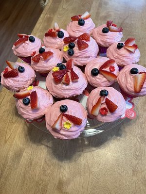 Strawberry flavored cupcakes with pink cream cheese frosting