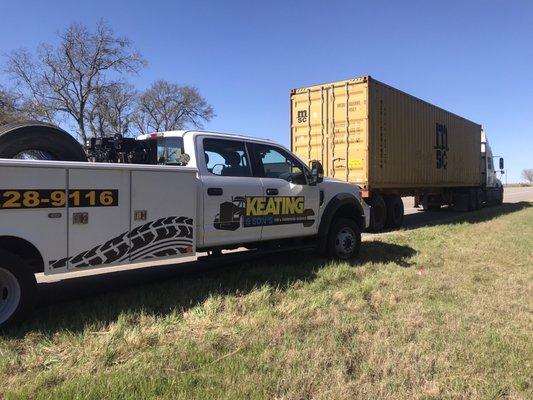 Replacing two 10.00-20 tires on an intermodal chassis & container in Flat, TX