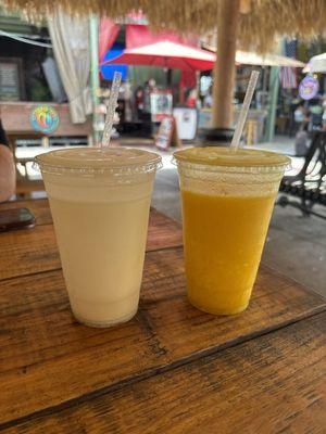 Coconut and pineapple smoothie on the left. Yellow   booster on the right.