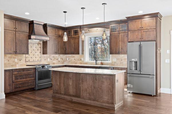 Granite countertops, custom backsplash, wide hardwood floors