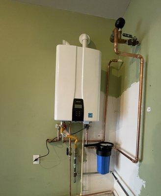 Shiny new tankless water heater after replacing 16 yr old 75 gallon tank water heater