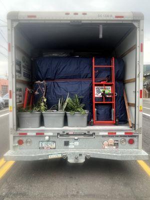 Truck all strapped down and loaded, ready to travel out of state.