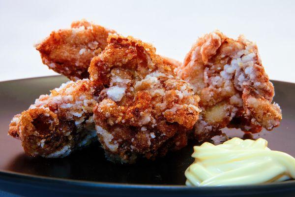 Karaage Japanese Fried Chicken - Marinated with  soy, sake and ginger.  Coated with a rice flour crispy coating