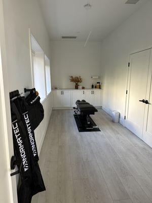 Treatment room featuring normatec for legs, hips, and arms