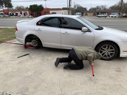 My father removing the tires that Rent-a-tire said couldn't be removed.