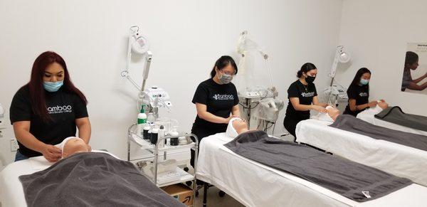 Esthetician Students Hand On Faccial Drape.