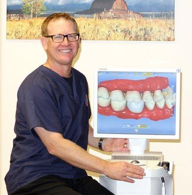 Dr. Francis with his computerized crown making technology equipment.