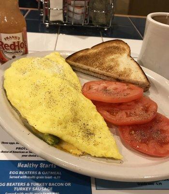 Three cheese omelet with fresh avocado.  Skip the hash browns and gimme one slice of toast for dessert.