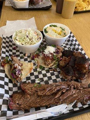 2 meat combo with 2 tacos. Pulled pork tacos, Brisket, burnt ends, coleslaws and corn.