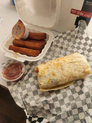 Burrito smaller than my hand, 4 French toast sticks that were supposed to be churros and a $2 side of garbage salsa.. smh