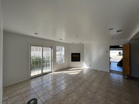 Family gathering area after clean and primer, but before paint/lighting/flooring.