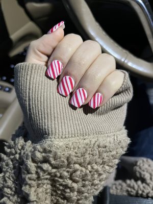 Acrylic nails with a candy cane design