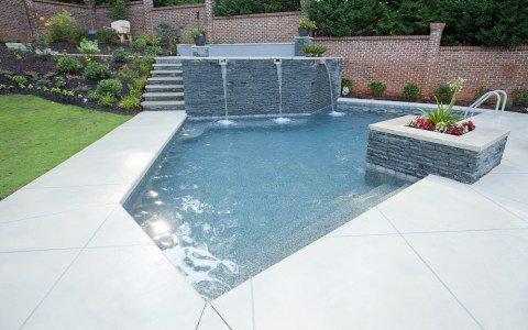 Raised spa with tumbled blue stone fascia.