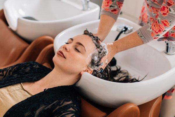 Enjoy a relaxing head massage and a conditioning treatment to revive your curls.