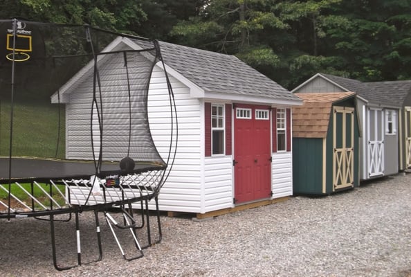 Pictured here are storage sheds and Springfree trampolines on display at Best in Backyards in Monroe, CT.